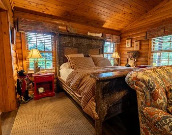 Dormitorio de la cabaña de troncos Timberland
