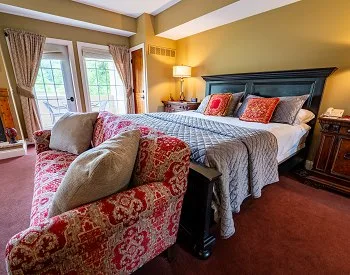Dormitorio y sofá de la suite Lancelot