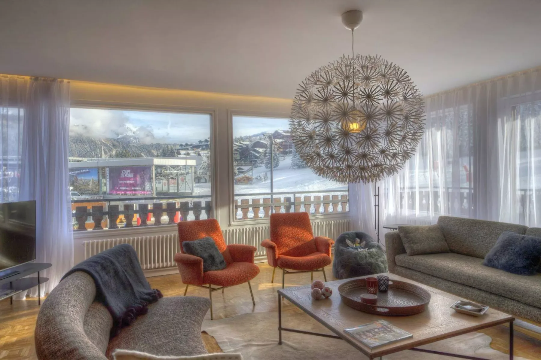 A living room with seating arranged around a low coffee table.