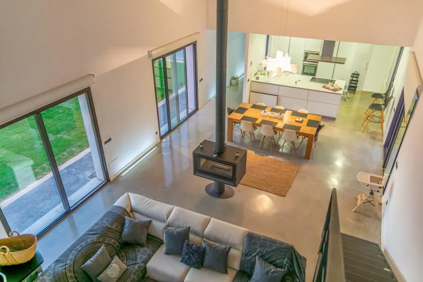 An open-plan living and dining area with a kitchen beyond.