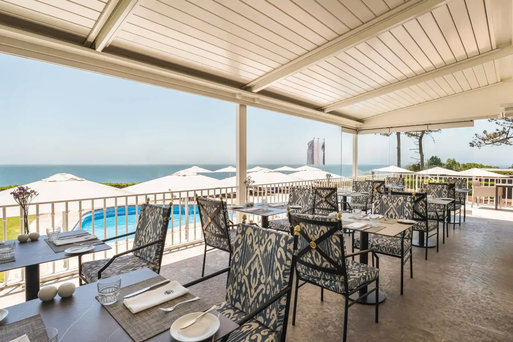Outdoor dining area with ocean view.