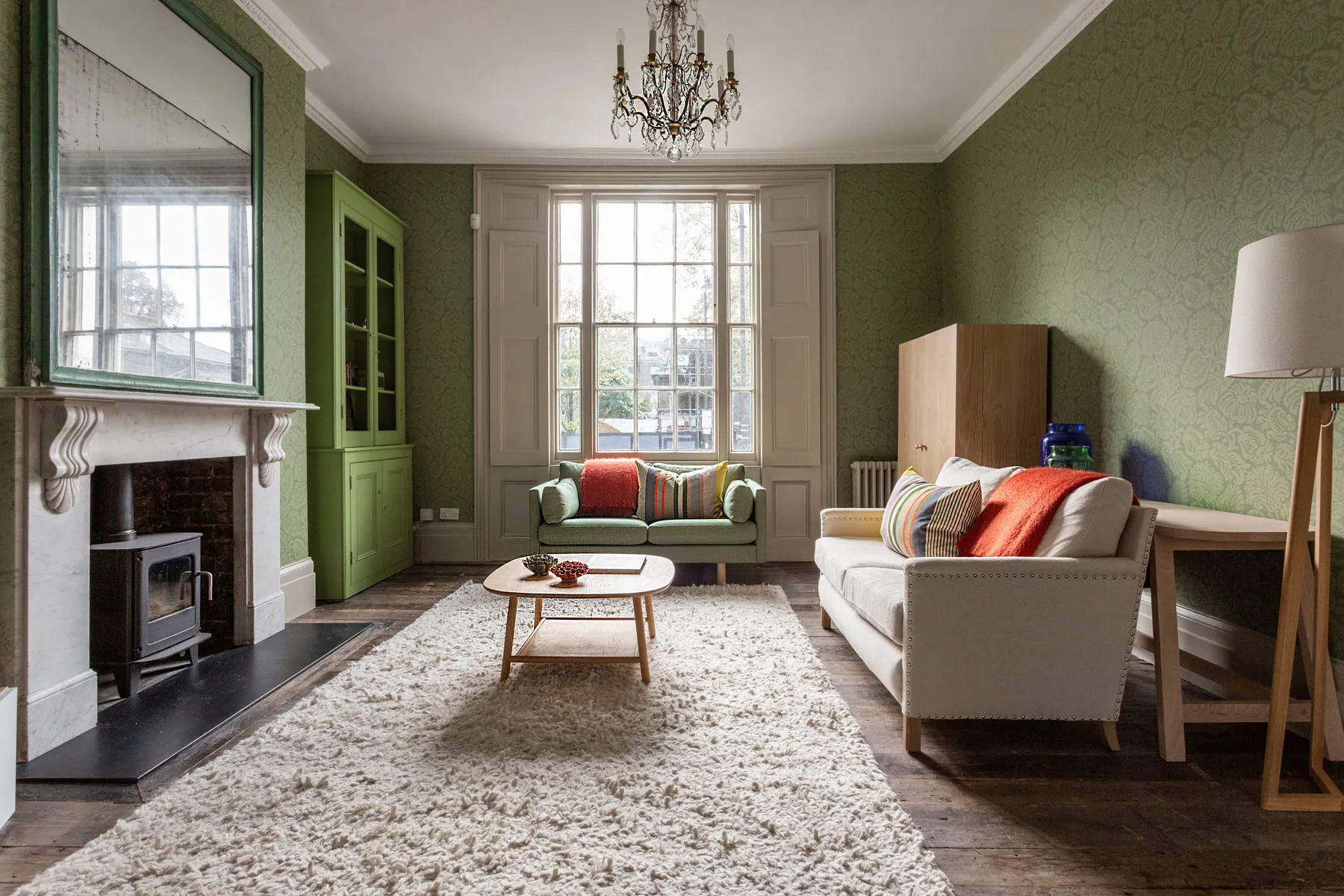 A living room with pale seating arranged around a coffee table.