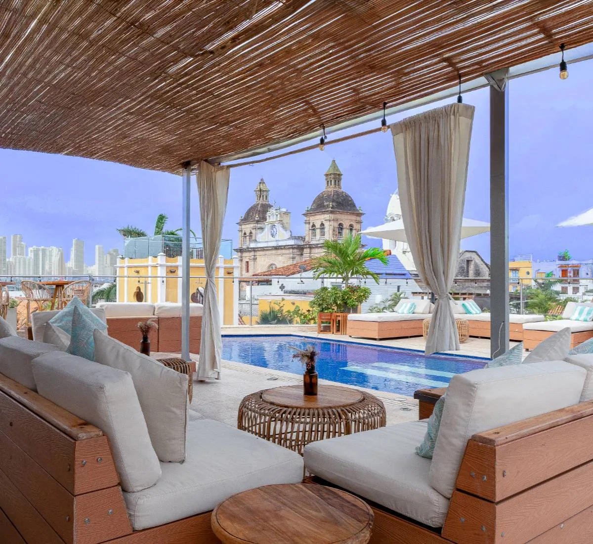 Hotel rooftop terrace with pool and pergola