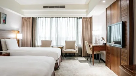 Habitación doble elegante con dos camas individuales