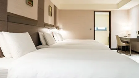 Elegant room with three medium beds