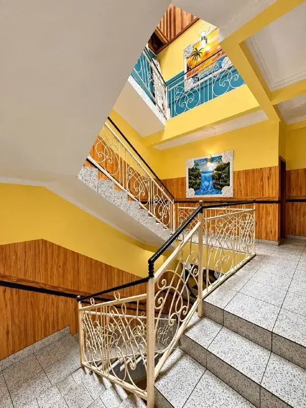 Hotel stairwell with wrought-iron railing