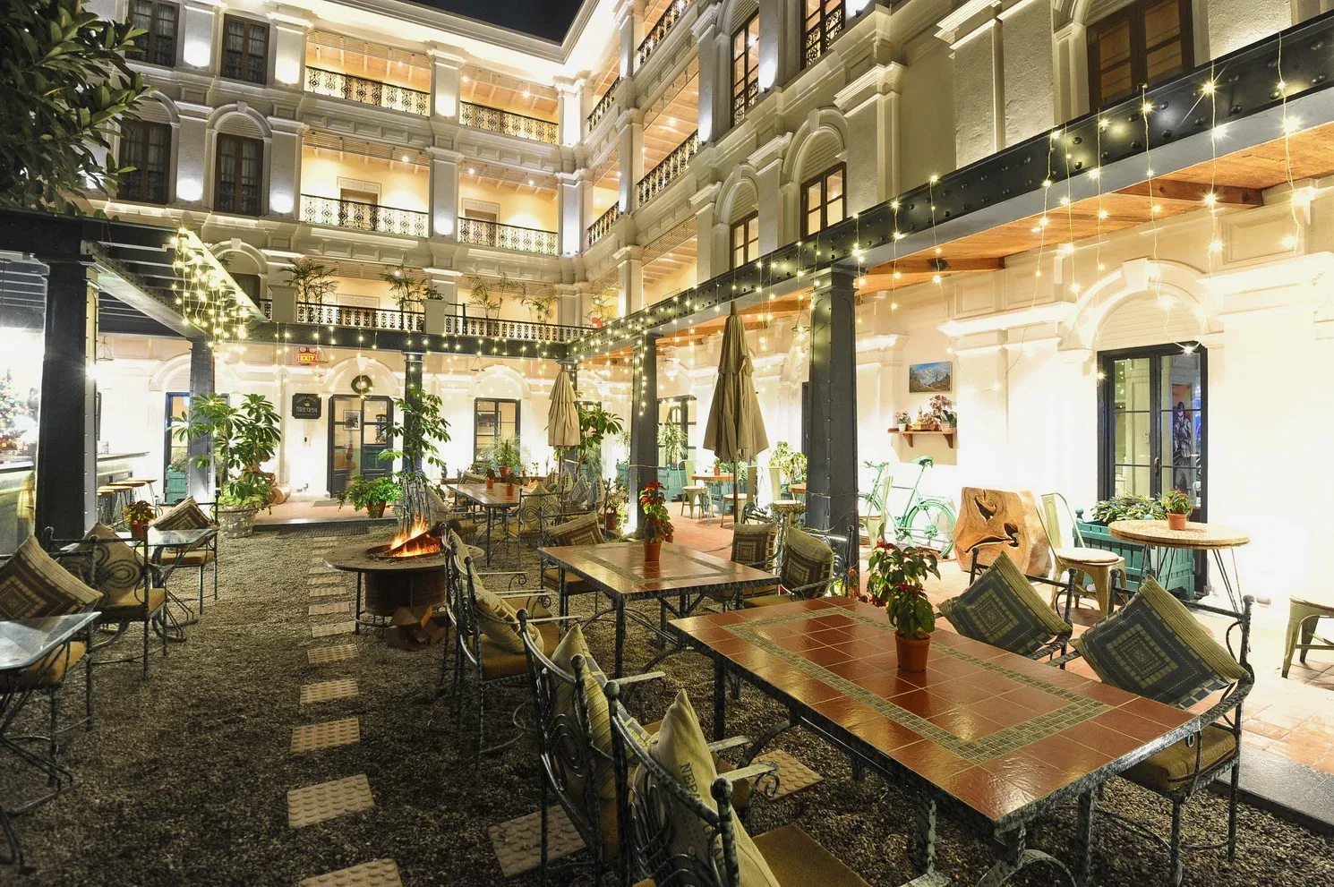 Garden seating beside the koi pond and waterfall at night.