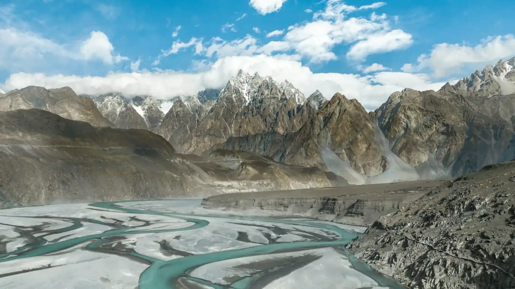 Panoramic Ghizer Valley with mountains and river at sunrise