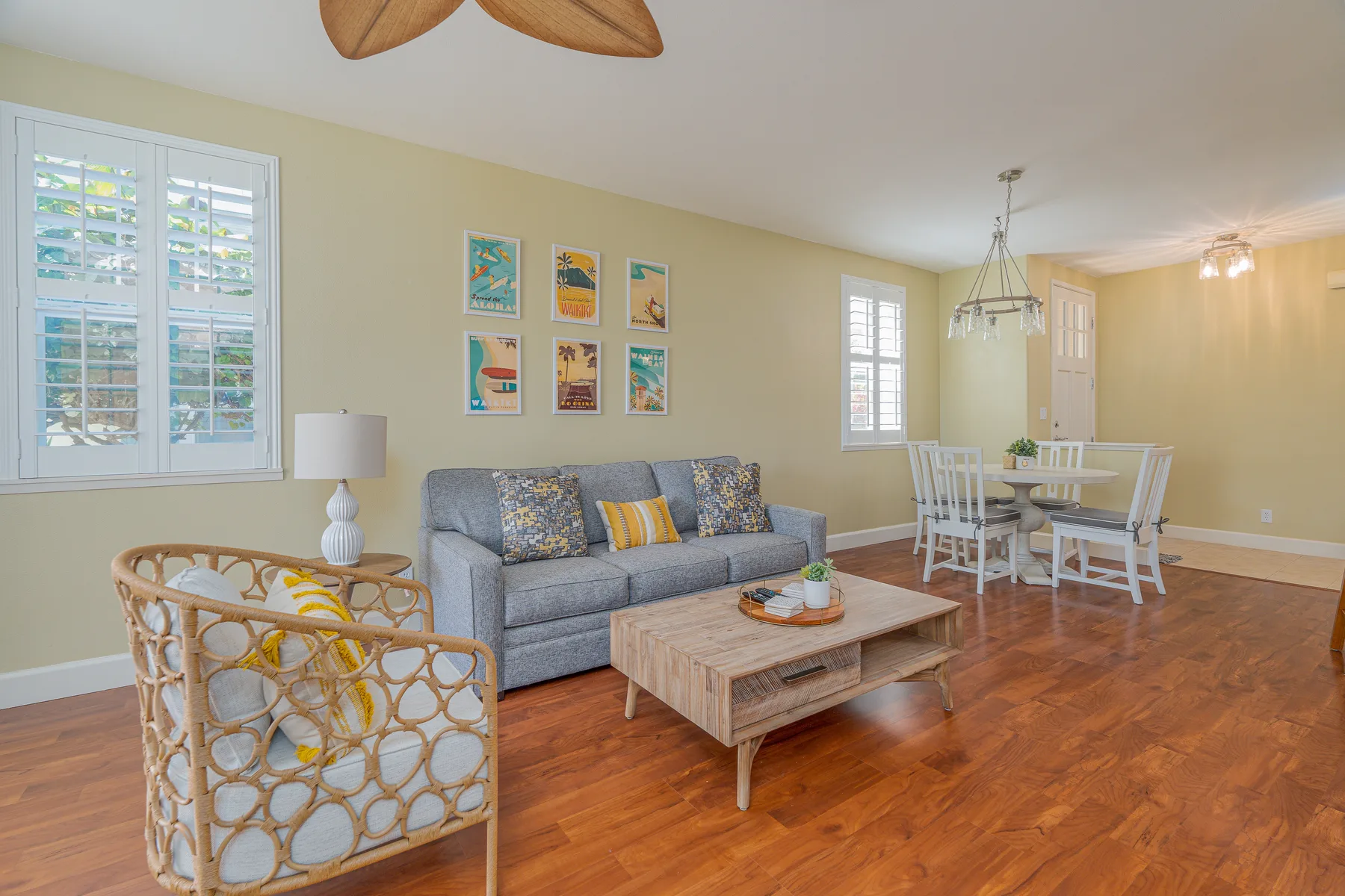 A living and dining room with seating, a coffee table, and a dining table.
