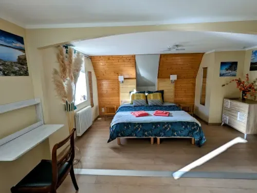 Chambre Printemps with a double bed and mountain views.