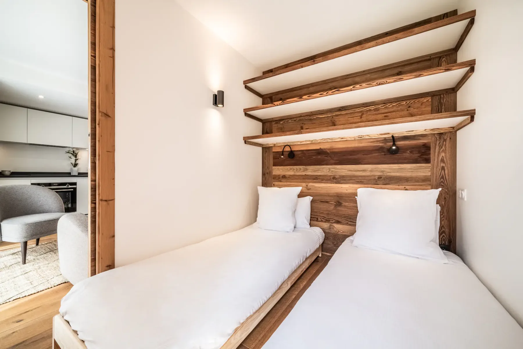 A bedroom with wooden walls and a wooden bed.