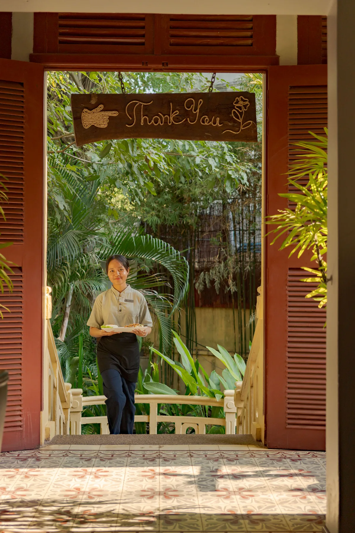 Areca Restaurant staff with food