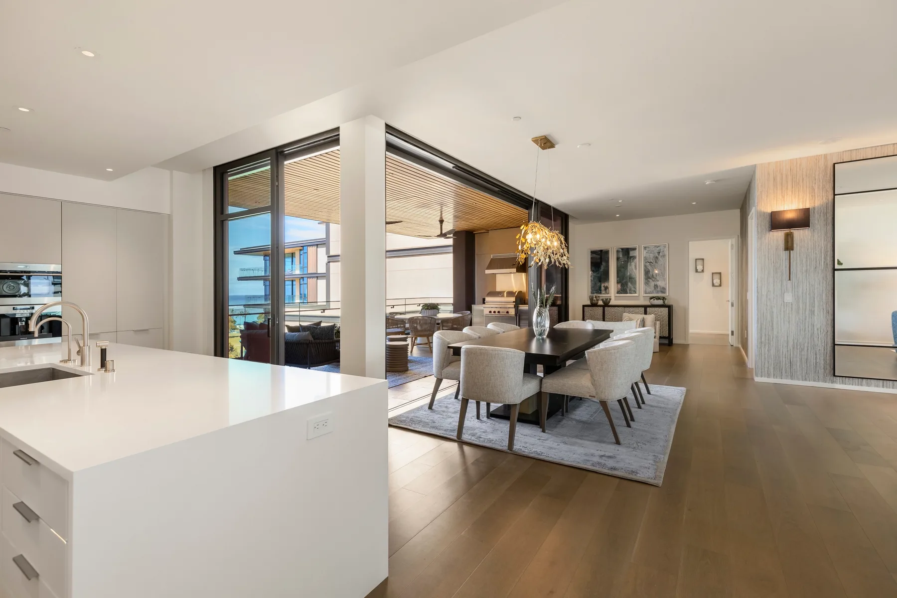 An open-plan kitchen and dining area with a large island and dining table.