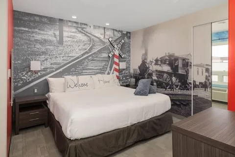 Queen bed in the Back-In-Time Theme Suite