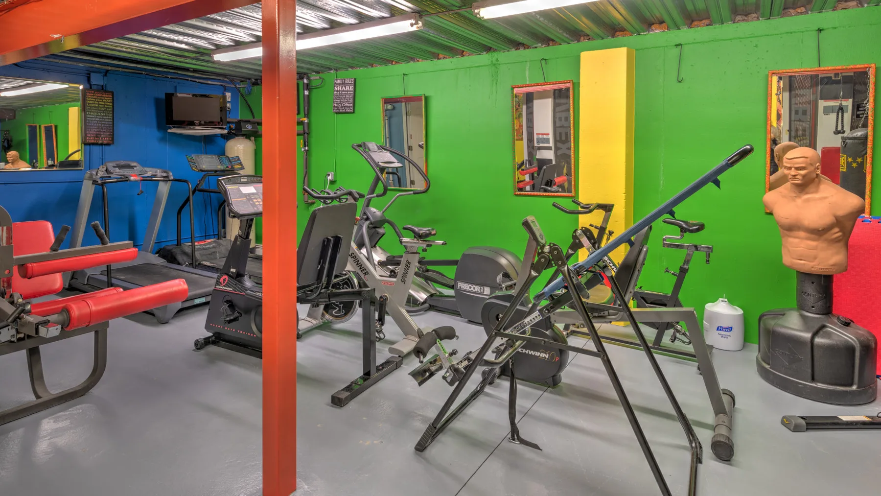 A gym with exercise machines and weight-training equipment.