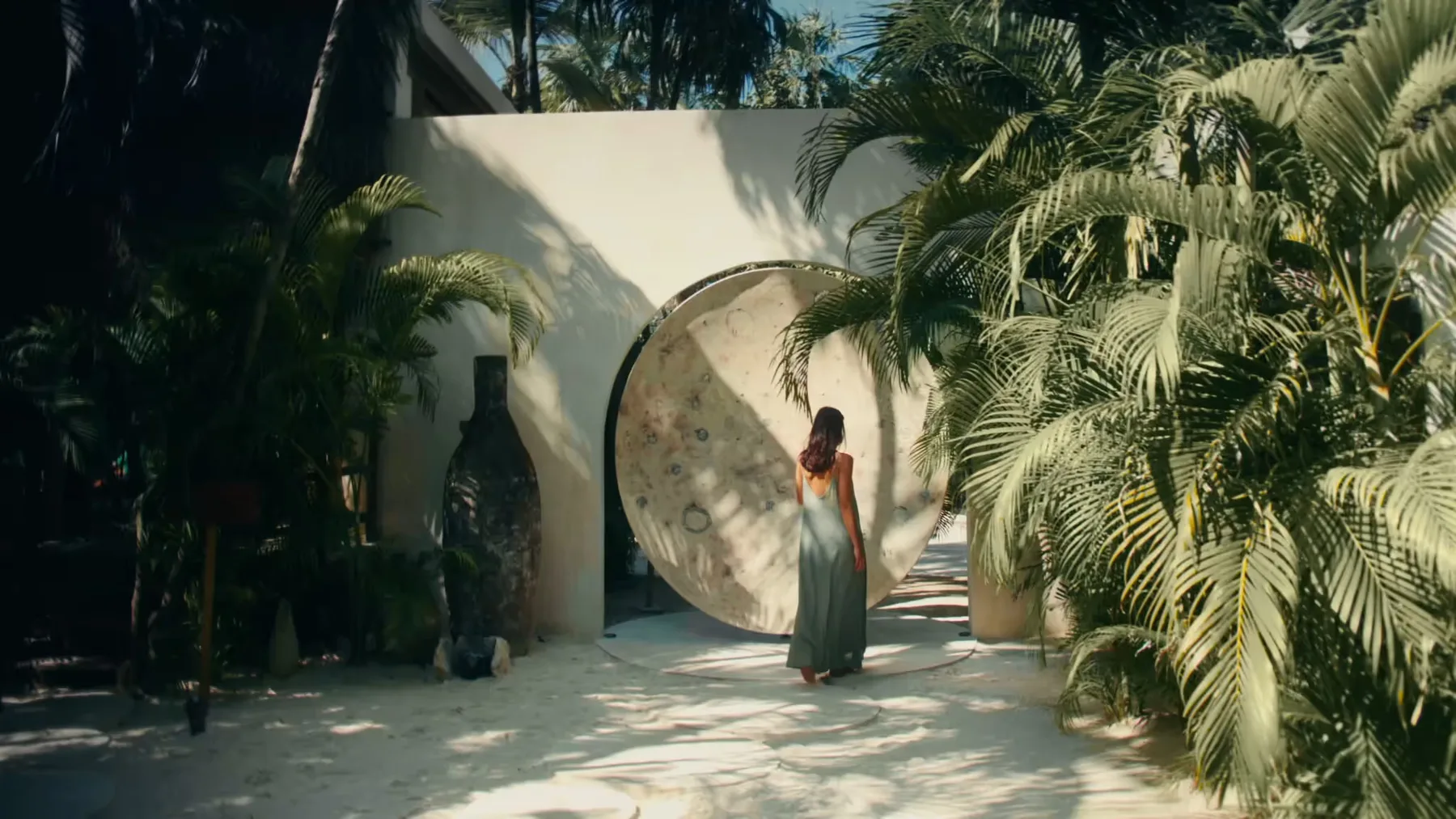 Aerial view of plunge pools amid the hotel’s palm garden.