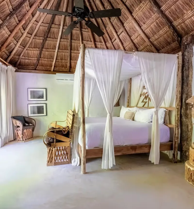 Hotel room with terrace access and artisanal design.