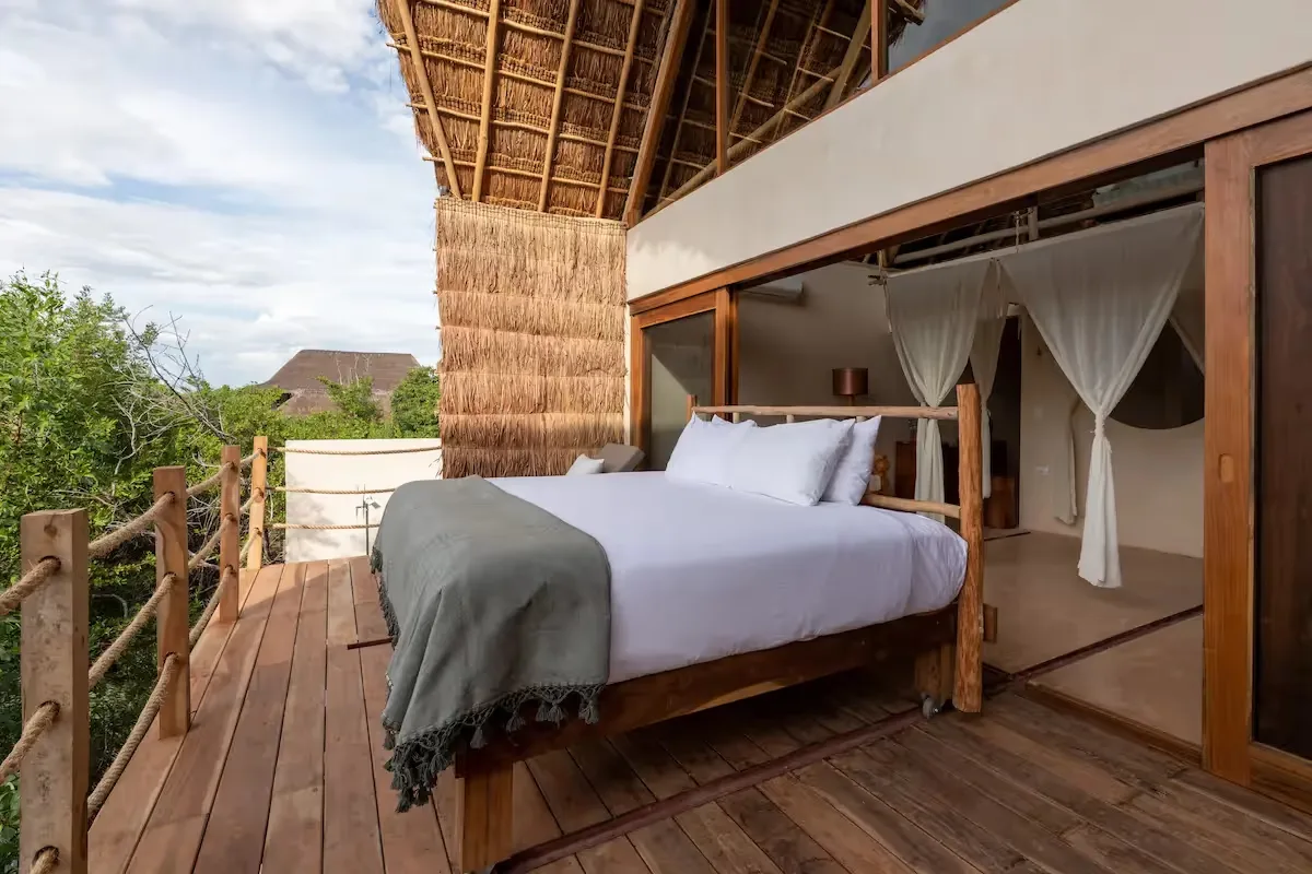 Suite terrace with an outdoor bed and panoramic views.