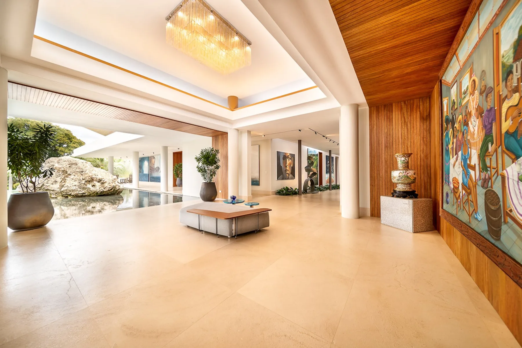 A spacious lobby with a low central table and colorful wall artwork.
