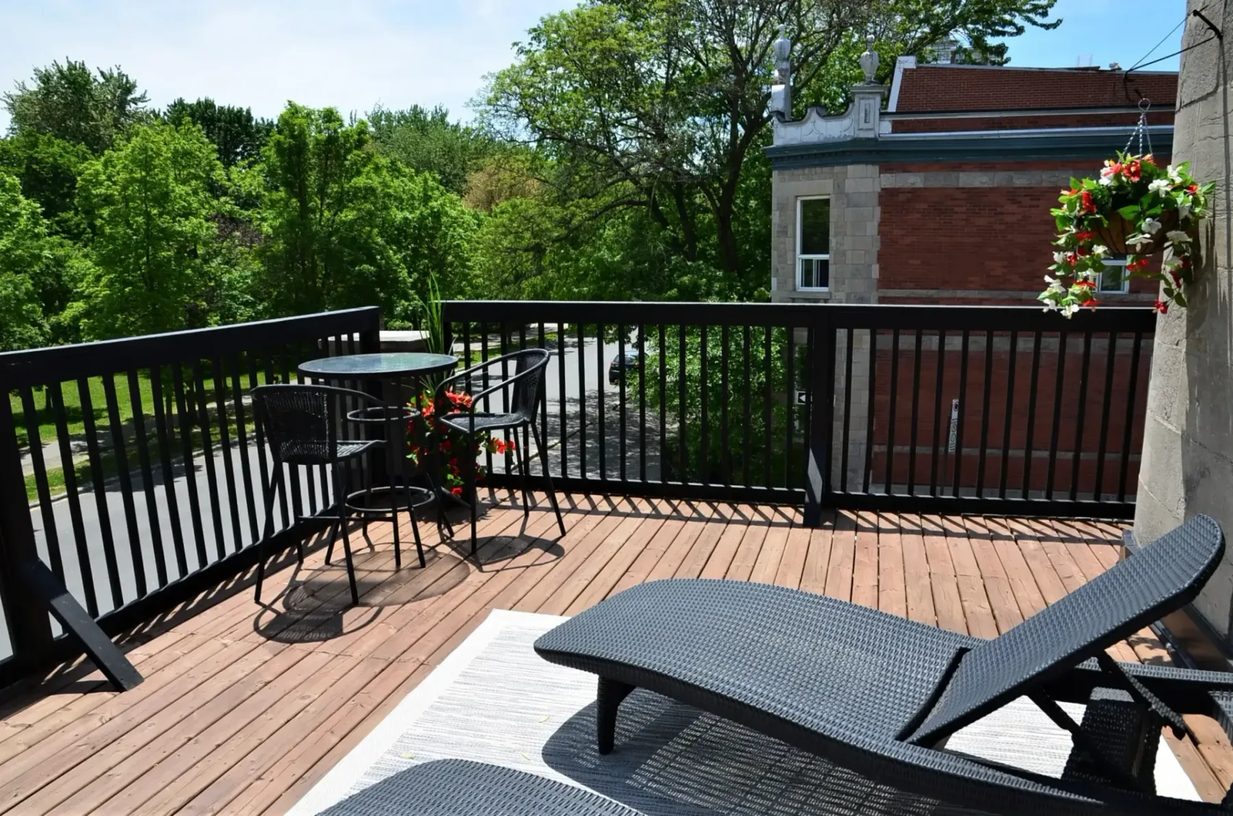 A terrace with a table and chairs.