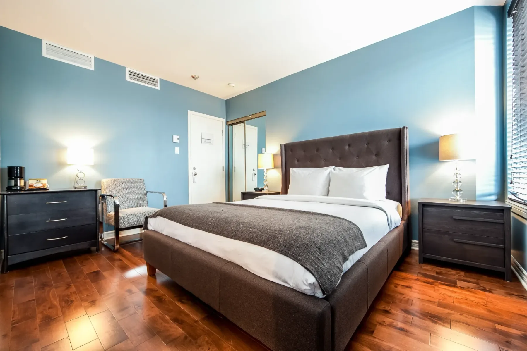 A room with a large bed.