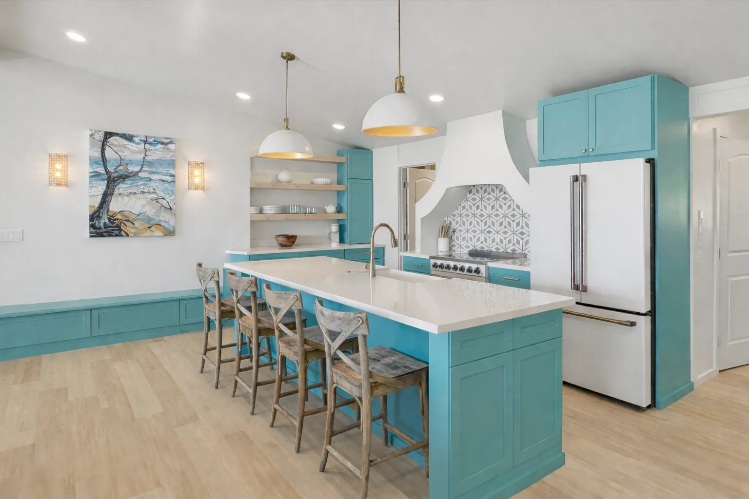 A bright kitchen with turquoise cabinets and a long island lined with seating.