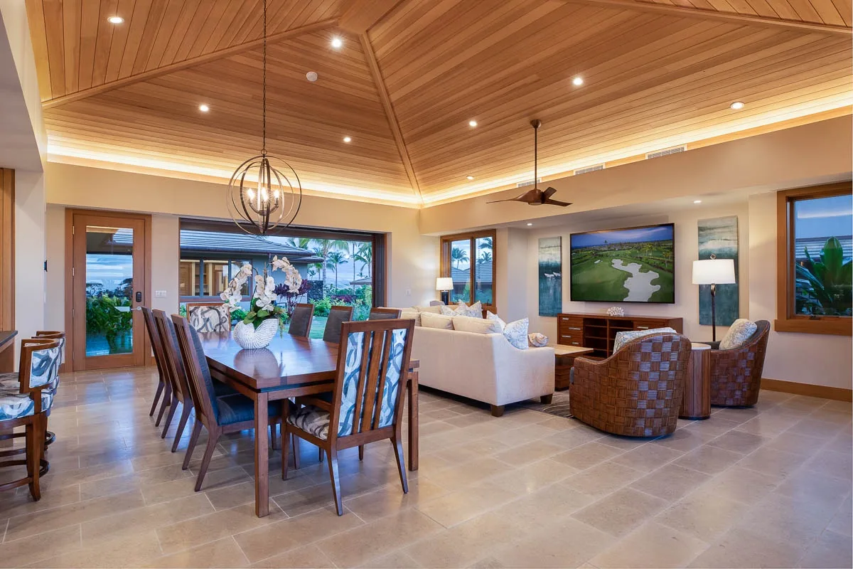 An open-plan living and dining room with a dining table and seating area.