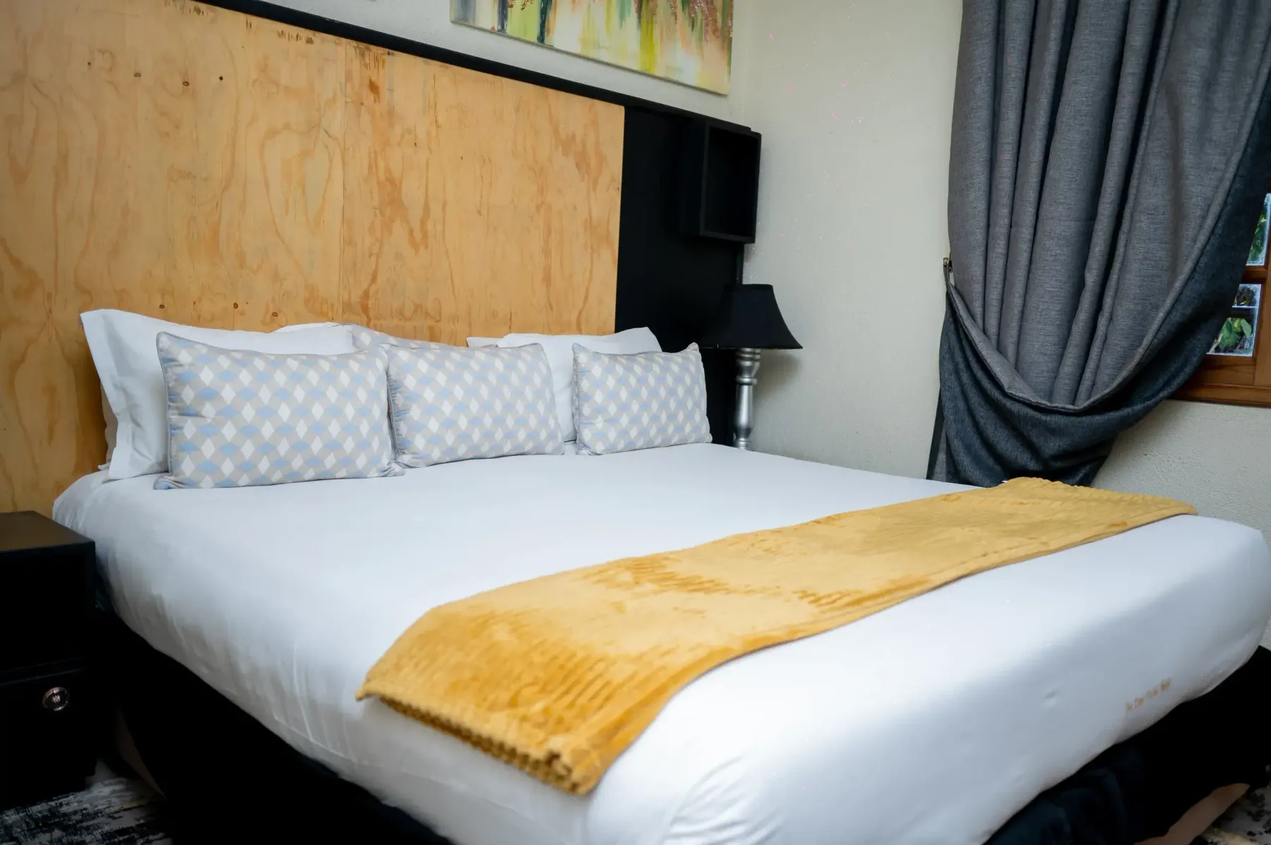 Apartment Room with a king bed and gold runner