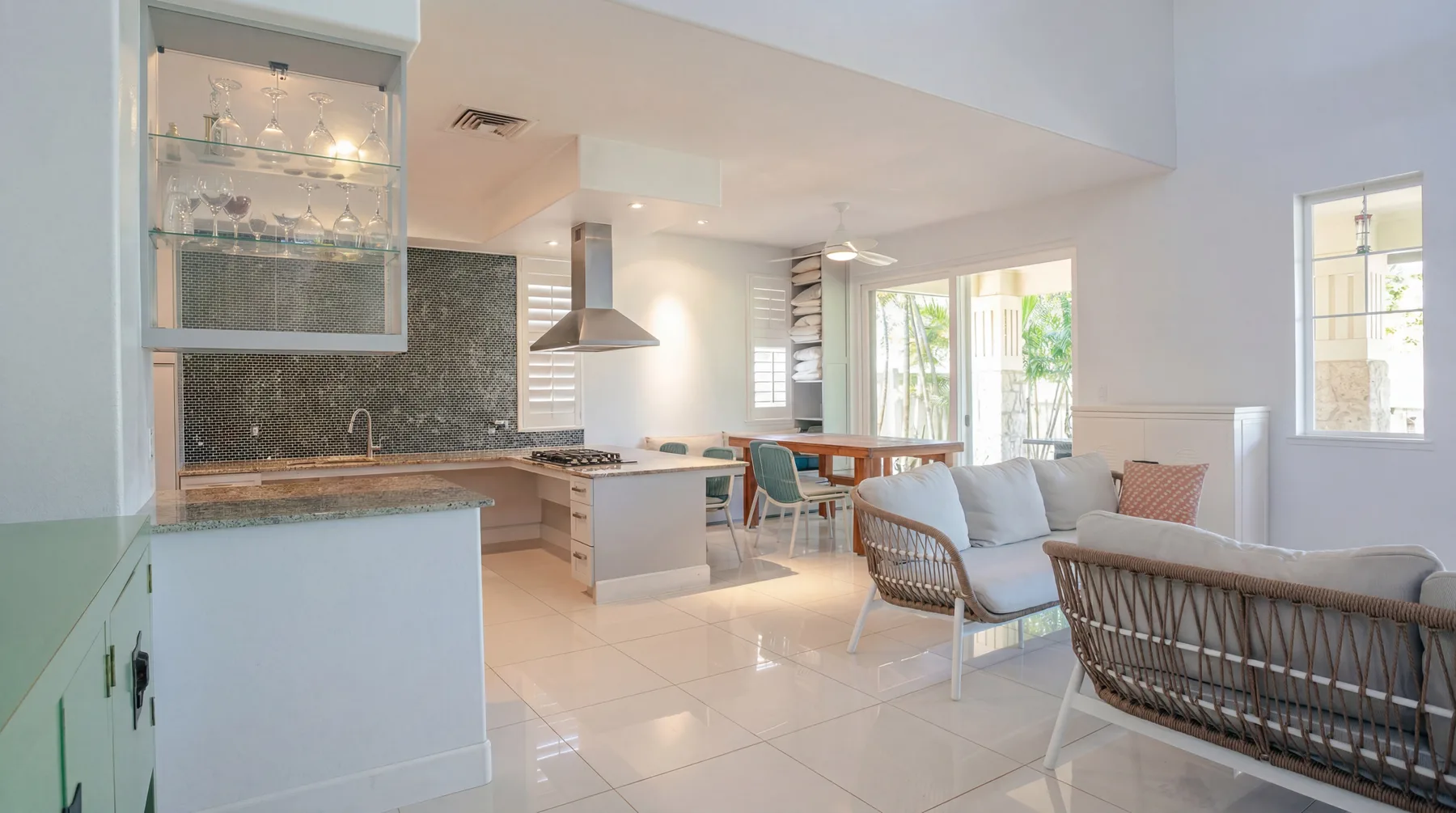 An open-plan kitchen and living area with a dining counter and seating.