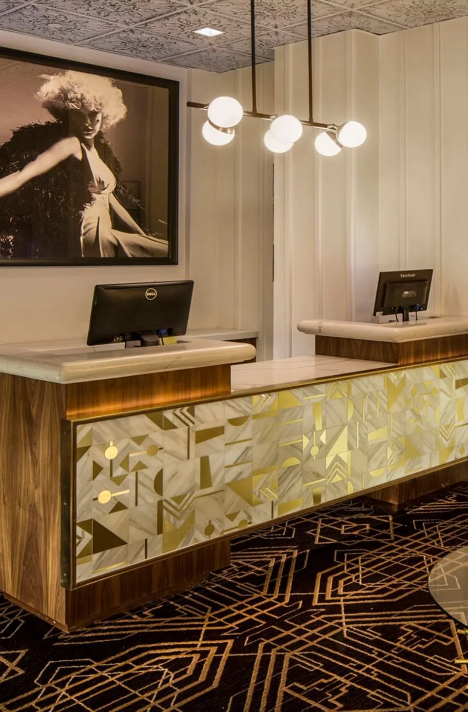 Hotel Bijou lobby with reception desk and carpeted floors