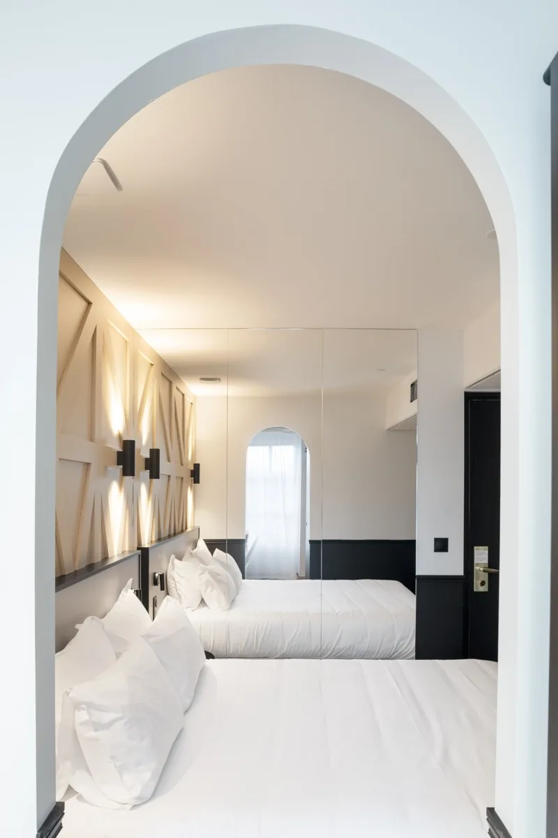 Business traveler relaxing on a hotel bed