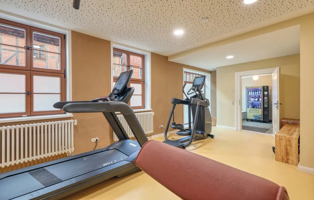 A small fitness room with treadmills and exercise equipment.