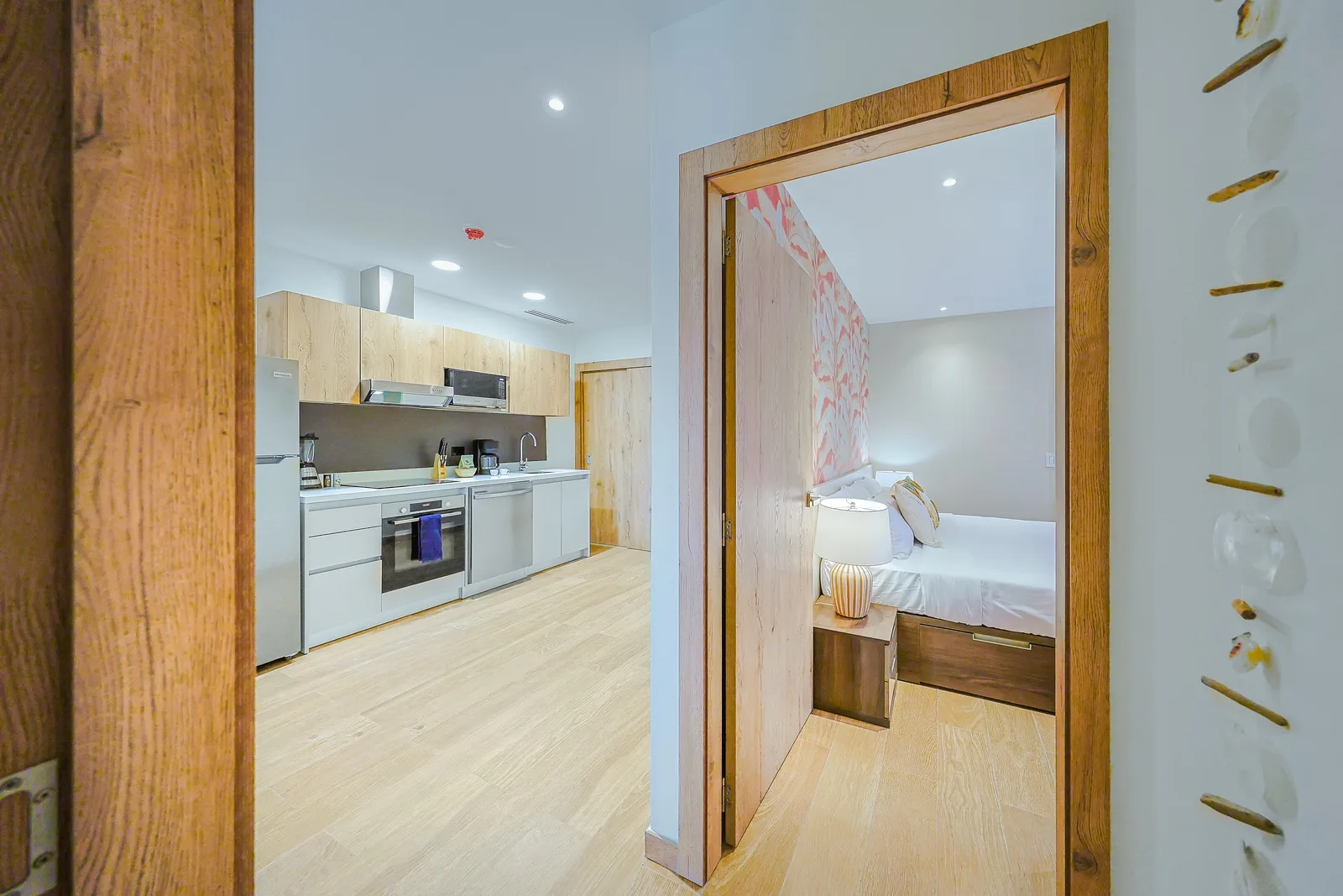 Enjoy a thoughtfully designed layout where the modern kitchen and serene bedroom flow seamlessly together, creating a comfortable and inviting retreat.