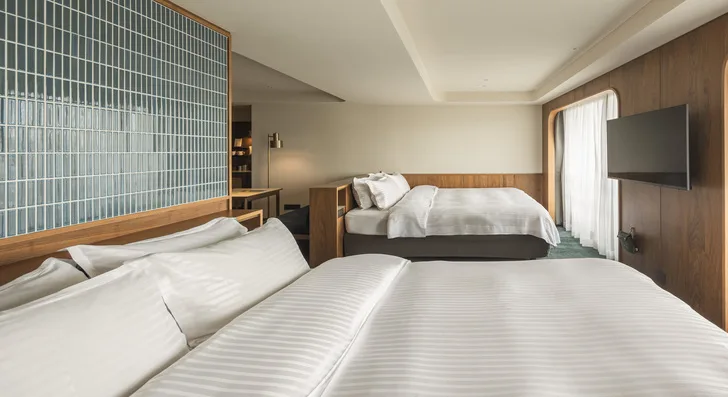 Habitación cuádruple deluxe con dos camas grandes