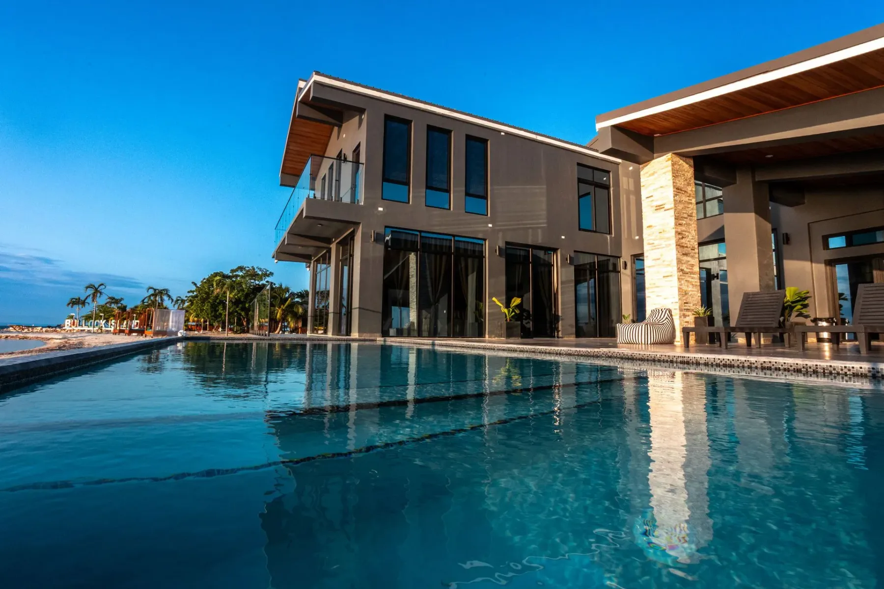 Modern villa with an infinity pool overlooking the ocean.
