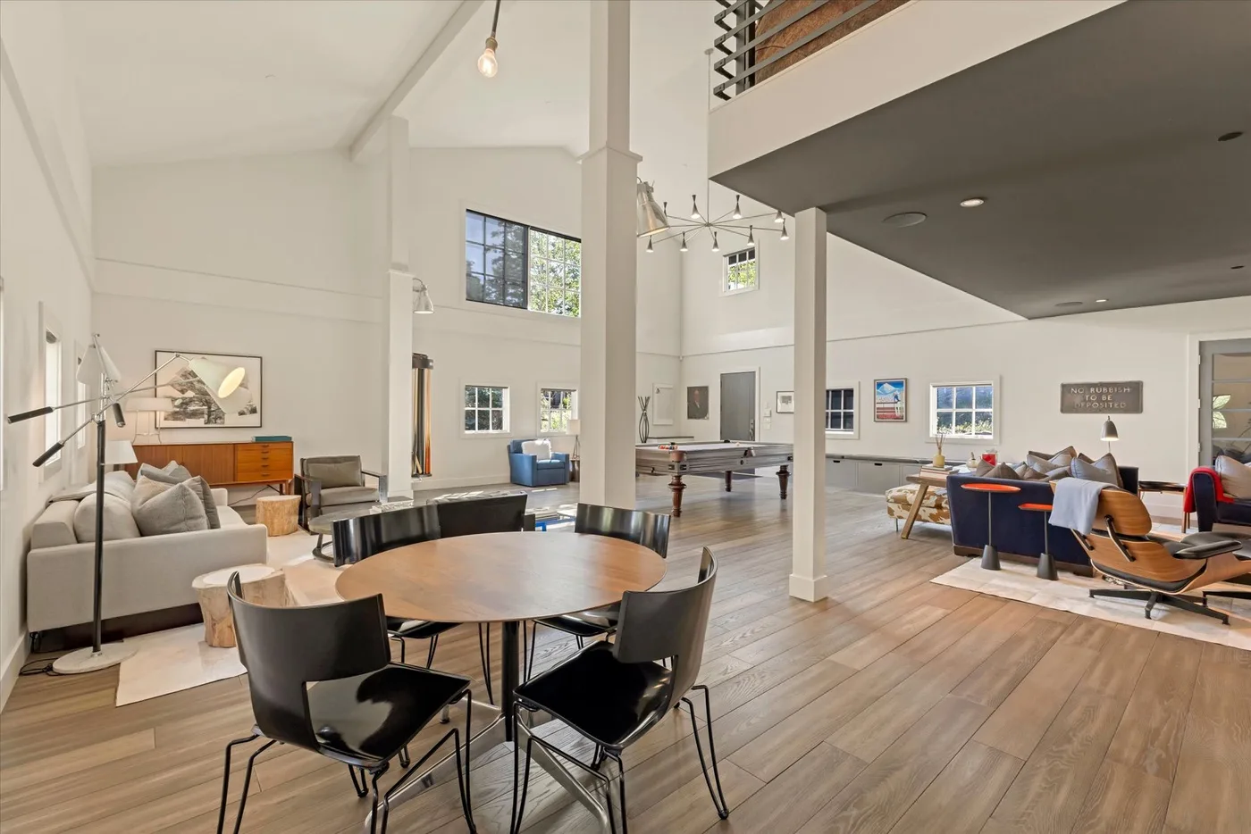 A spacious open-plan living and dining area with seating and a large table.