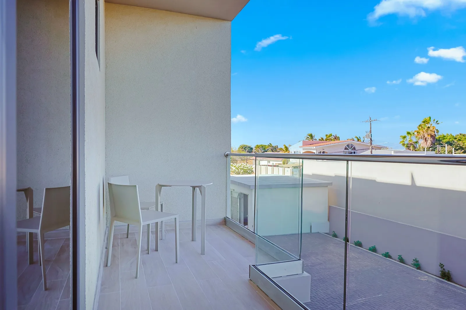 Step into your private balcony and feel the island breeze in a stylish tropical modern space