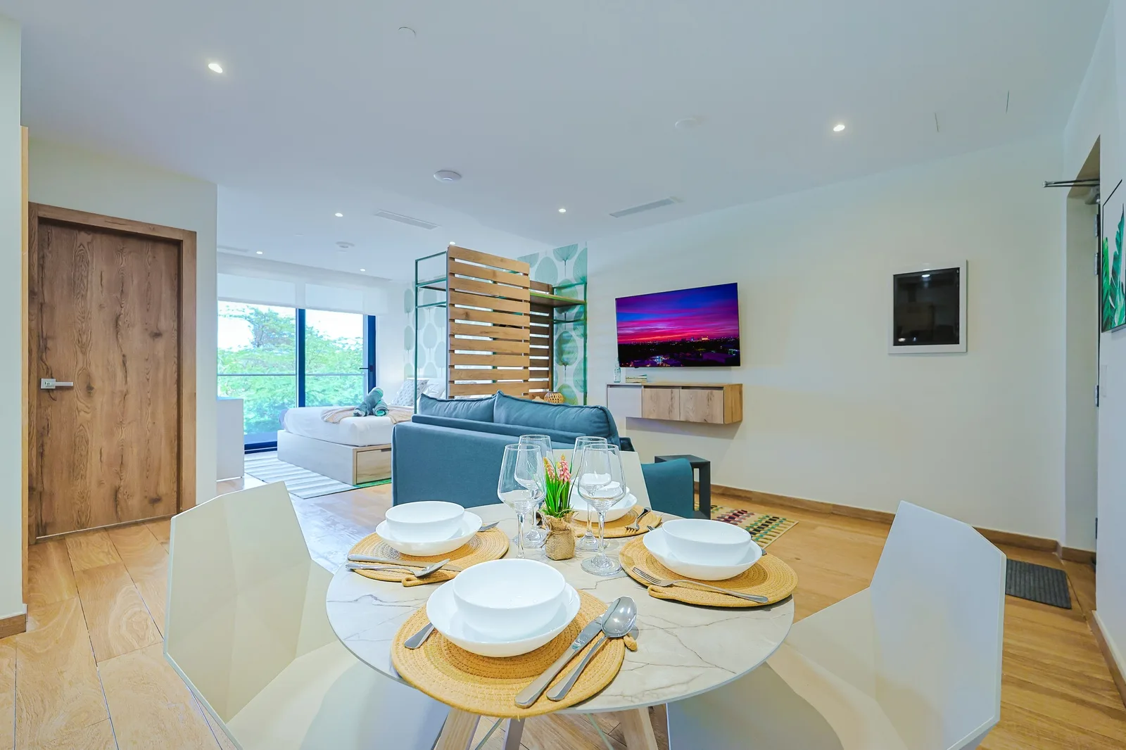 Picture yourself dining here—warm wood tones, modern elegance, and the open layout invites you to relax.