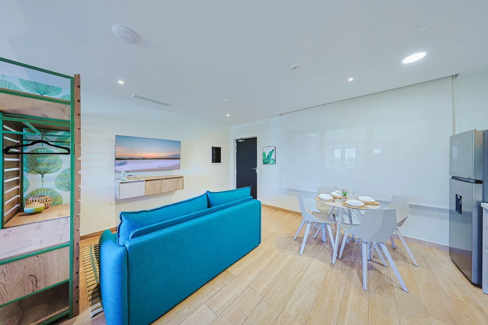 Step into your bright, open living space where coastal blues meet modern comfort.