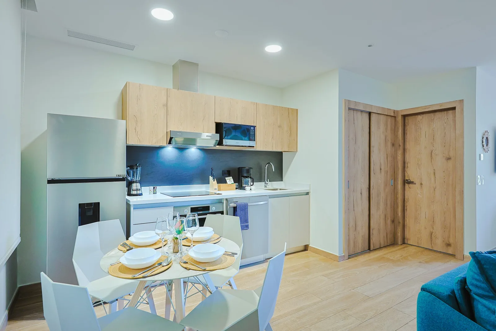 Your modern kitchen offers sleek cabinetry, a stylish backsplash, and thoughtful amenities