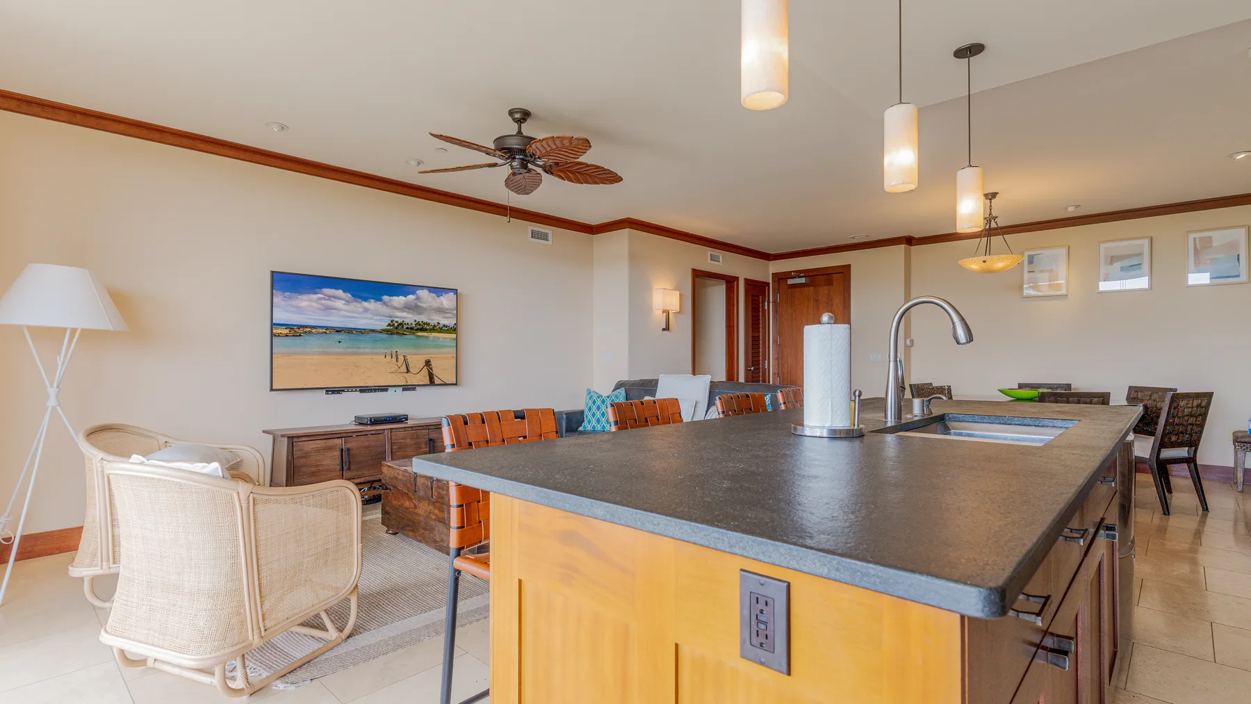 An open-plan kitchen and living area with a large island and seating.