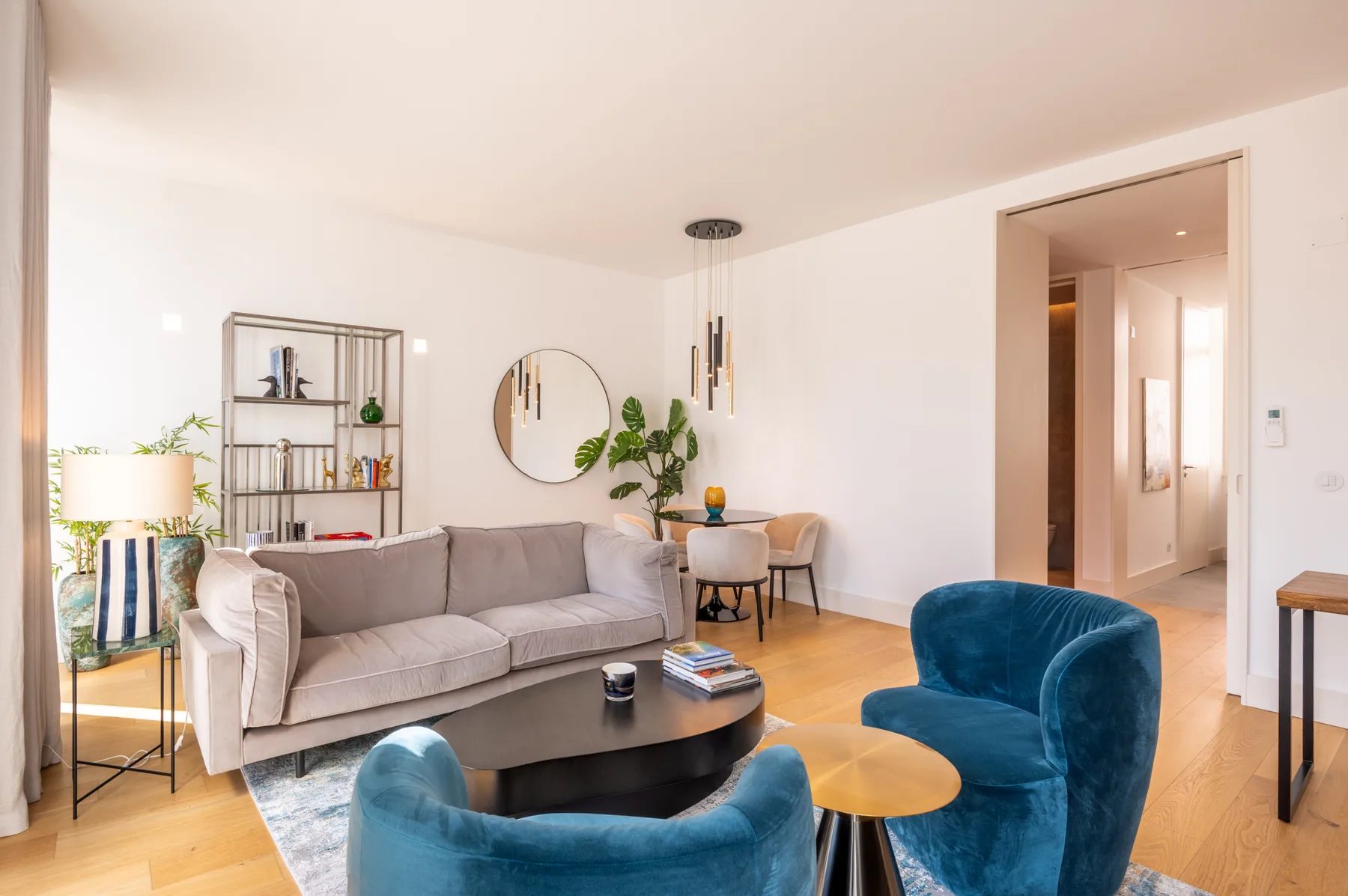 A bright living room with seating around a low coffee table.