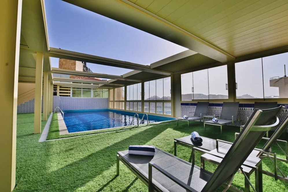 Rooftop pool overlooking Petra’s rose-red cliffs