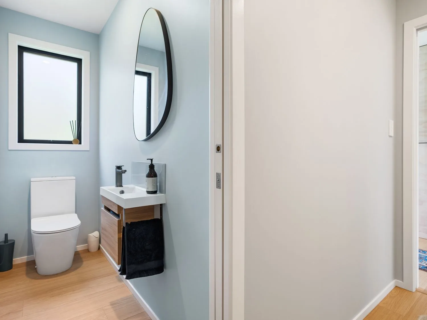 A bathroom with a sink and toilet at The Cove Escape - Cooks Beach