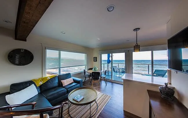 Open-concept living room with sliding doors to patio