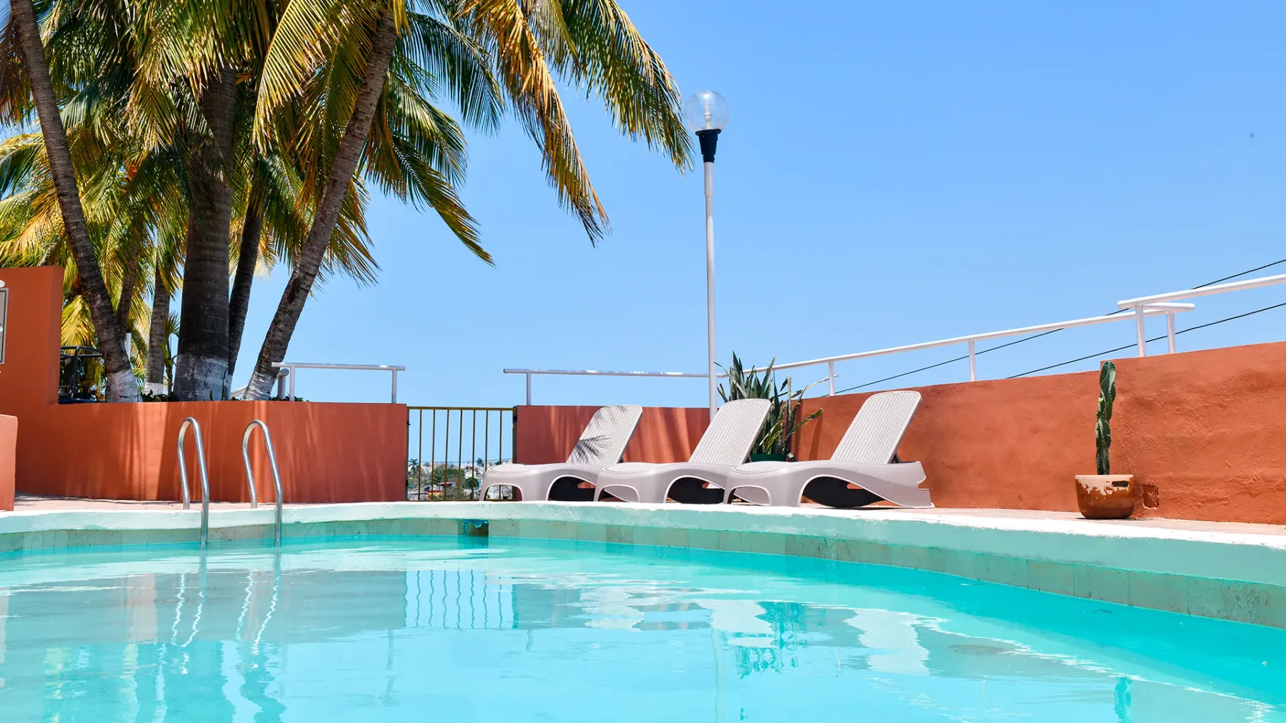 Outdoor swimming pool with lounge chairs