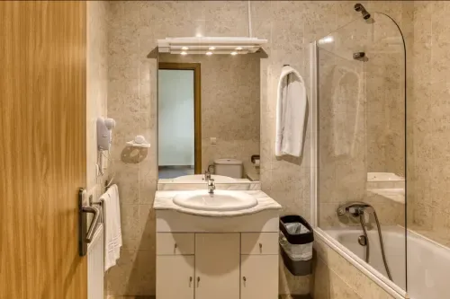 Bathroom with bathtub and shower
