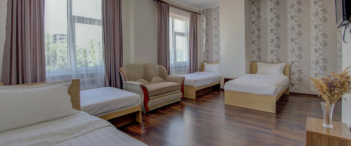 Habitación cuádruple con camas separadas