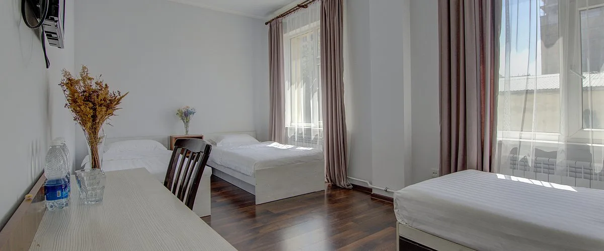 Habitación triple con camas separadas