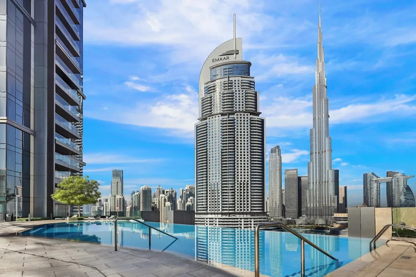 An outdoor pool overlooks Dubai’s skyline, including the Burj Khalifa.